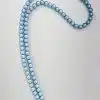Entdecken Sie die zauberhafte Welt der „Magische Perlen“-Halskette! Diese trendige Statement-Kette zieht garantiert alle Blicke auf sich. Mit zwei Strängen aus strahlenden Türkis-Perlen, die in einem stilvollen Loop angeordnet sind, wird Dein Look im Handumdrehen zu etwas ganz Besonderem. Und das Highlight? Der runde, silberfarbene Verschluss ist mit funkelnden Kristallen verziert und setzt einen edlen Akzent. Perfekt für alle Fashionistas, die ihrem Outfit den letzten Schliff verleihen wollen!.