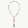 Erlebe deinen Style mit dieser trendigen Kette aus pink-lila Perlen, Stern- und Buddha-Anhängern und coolem Quastenabschluss.