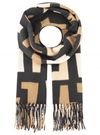 Erlebe den modernen Look: Du trägst den Geo-Muster Schal von Zwillingsherz in Beige, Schwarz und Weiß mit trendigen Fransen.