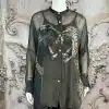 Entdecke die "Panther Clash" Bluse - transparenter, schwarzer Style mit wilden Raubkatzen, präsentiert für deinen urbanen Look.