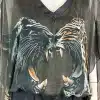 Mit der "Wild Clash" Tunika fällst du auf: Transparentes Schwarz, zwei Raubkatzen als Eyecatcher, wild und ausdrucksstark.