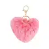 Verleihe deinem Look mit dem pinken, flauschigen Herz-Anhänger Glamour - goldene Details setzen stylishe Akzente!.