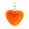 Entdecke dein neues Lieblings-Accessoire: Der flauschige Herz-Schlüsselanhänger in Orange mit goldenem Ring - stylish & trendy!.