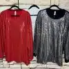 Entdecke deinen Style: Glam Sequin Oversize-Shirts in Rot, Weiß und Schwarz - trendiger Hingucker vor urbaner Steinwand.