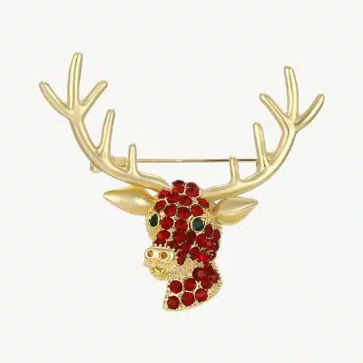 Erlebe deinen Statement-Look: Goldene Hirschbrosche mit roten Edelsteinen, grünen Augen und eindrucksvollen Geweihen.