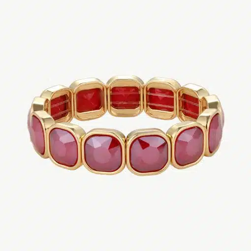 Erlebe puren Luxus: Dieses moderne Goldarmband mit leuchtend roten Edelsteinen lässt deinen Look stilvoll erstrahlen.