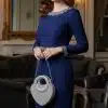 Strahle in deinem blauen Kleid und setze mit der Diamant Herz-Clutch im glamourösen Licht funkelnder Kronleuchter ein Statement.