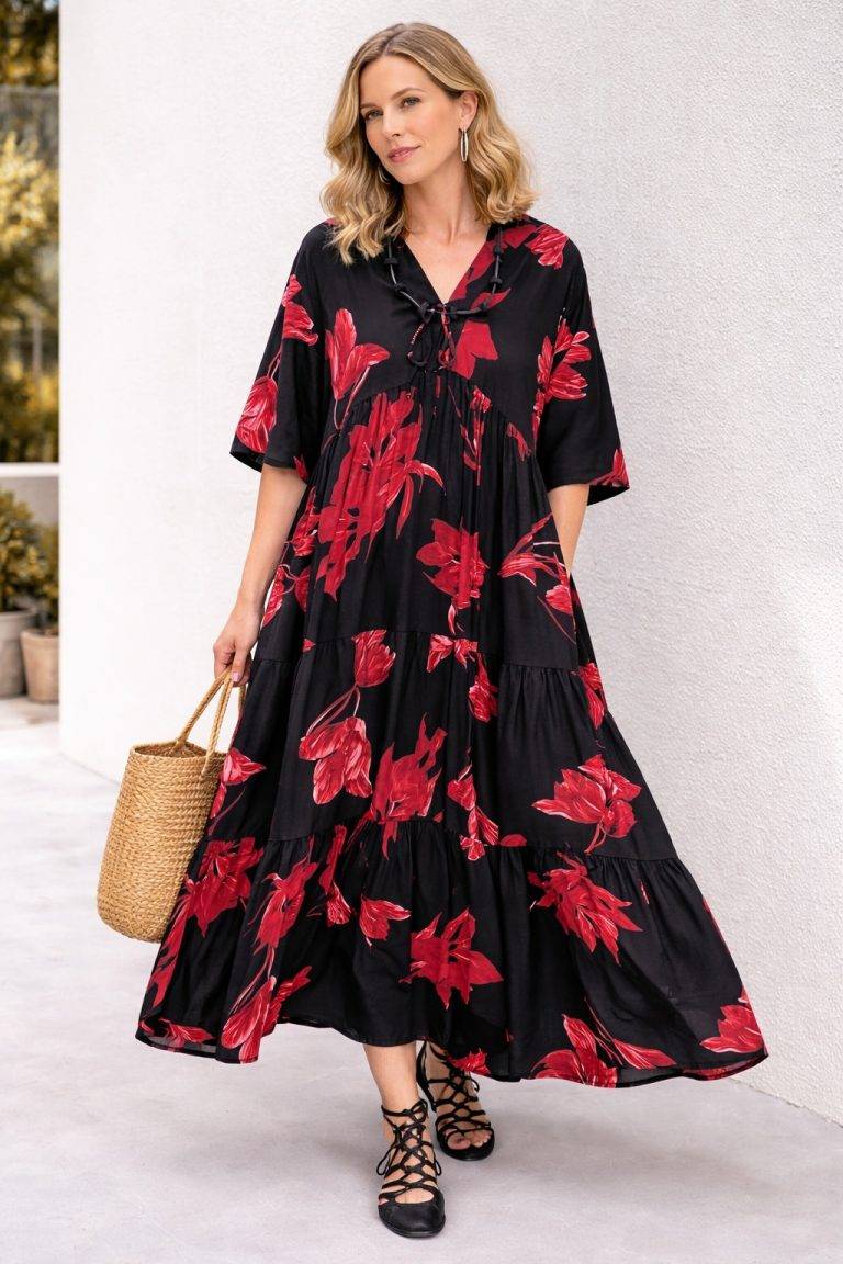 Frau modelliert Carmen Kleid XL, langes schwarzes Kleid mit rotem Blumendruck-schmeichelnde Passform, schicker Stil für Plus-Size-Outdoor-Looks.